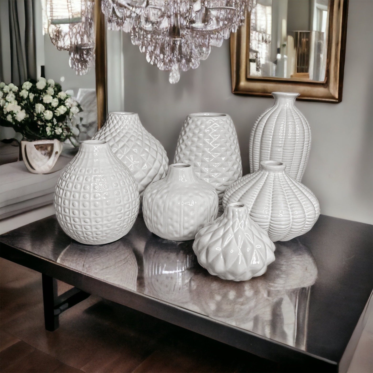 Elegant white ceramic Whitney Vases, artisan-made with exquisite detailing, perfect for flowers or home decor.