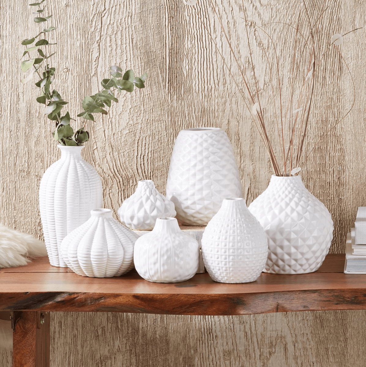 Elegant white ceramic Whitney Vases, artisan-made with exquisite detailing, perfect for flowers or home decor.