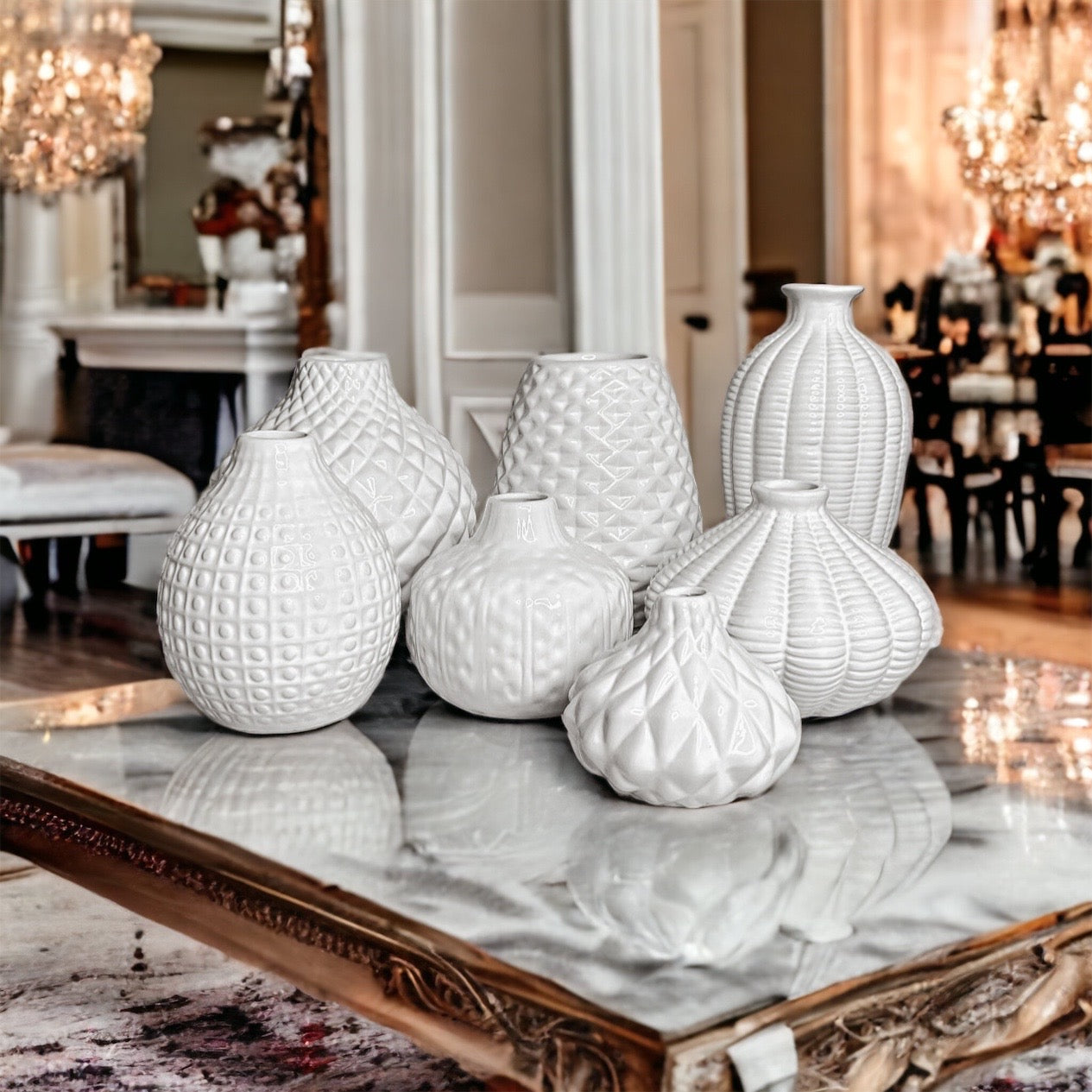 Elegant white ceramic Whitney Vases, artisan-made with exquisite detailing, perfect for flowers or home decor.