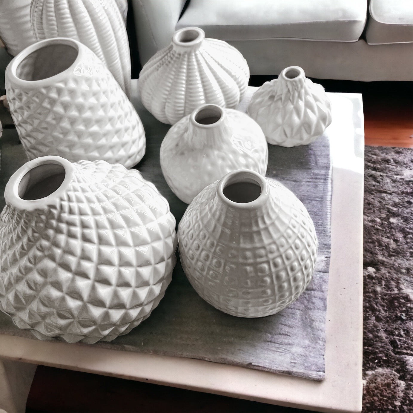 Elegant white ceramic Whitney Vases, artisan-made with exquisite detailing, perfect for flowers or home decor.