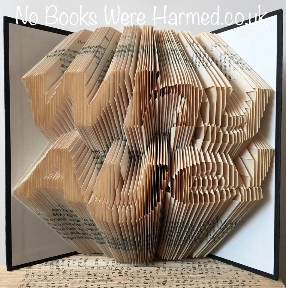 Handcrafted book art titled 'Why Aye!', showcasing unique folded pages from vintage books.