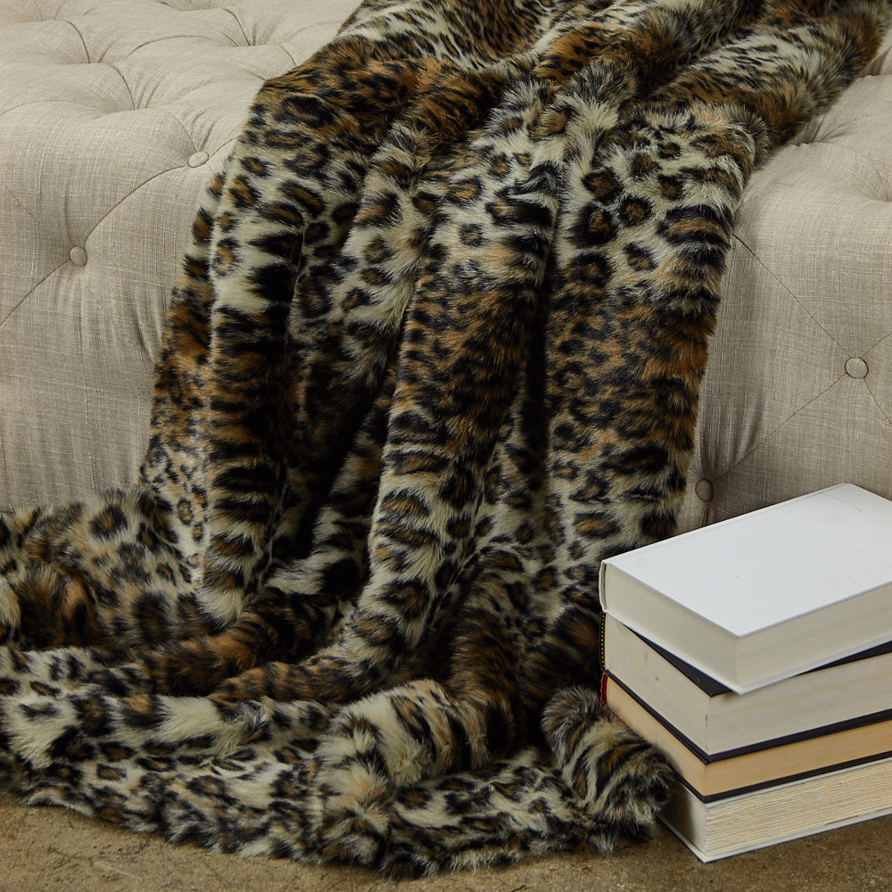 Wild Leo Faux Fur Luxury Throw in brown and beige, showcasing a plush texture and reversible design.