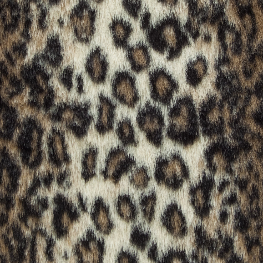 Wild Leo Faux Fur Luxury Throw in brown and beige, showcasing a plush texture and reversible design.