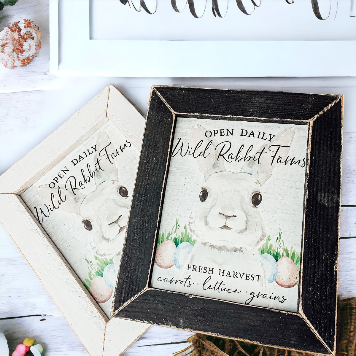 Wild Rabbit Farms Easter sign featuring a rustic design with pastel eggs and a hand-painted wooden frame.