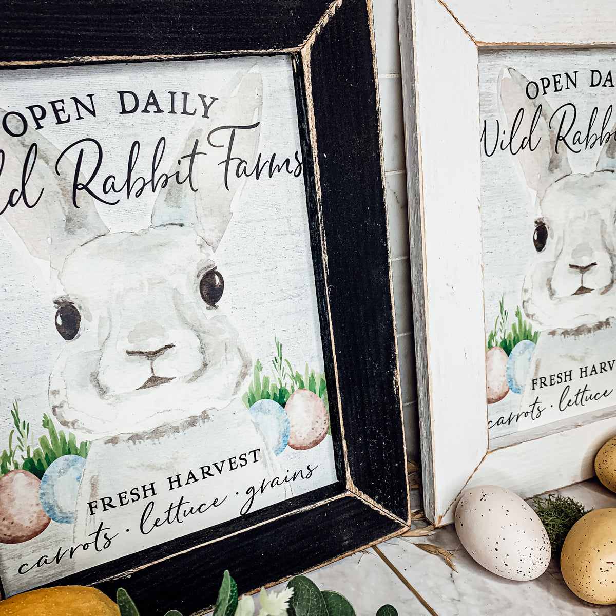 Wild Rabbit Farms Easter sign featuring a rustic design with pastel eggs and a hand-painted wooden frame.