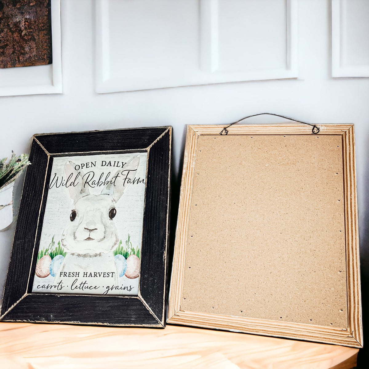 Wild Rabbit Farms Easter sign featuring a rustic design with pastel eggs and a hand-painted wooden frame.