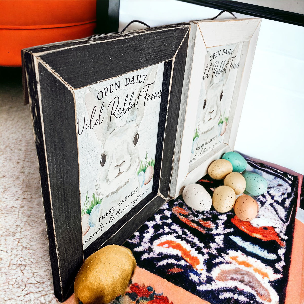 Wild Rabbit Farms Easter sign featuring a rustic design with pastel eggs and a hand-painted wooden frame.