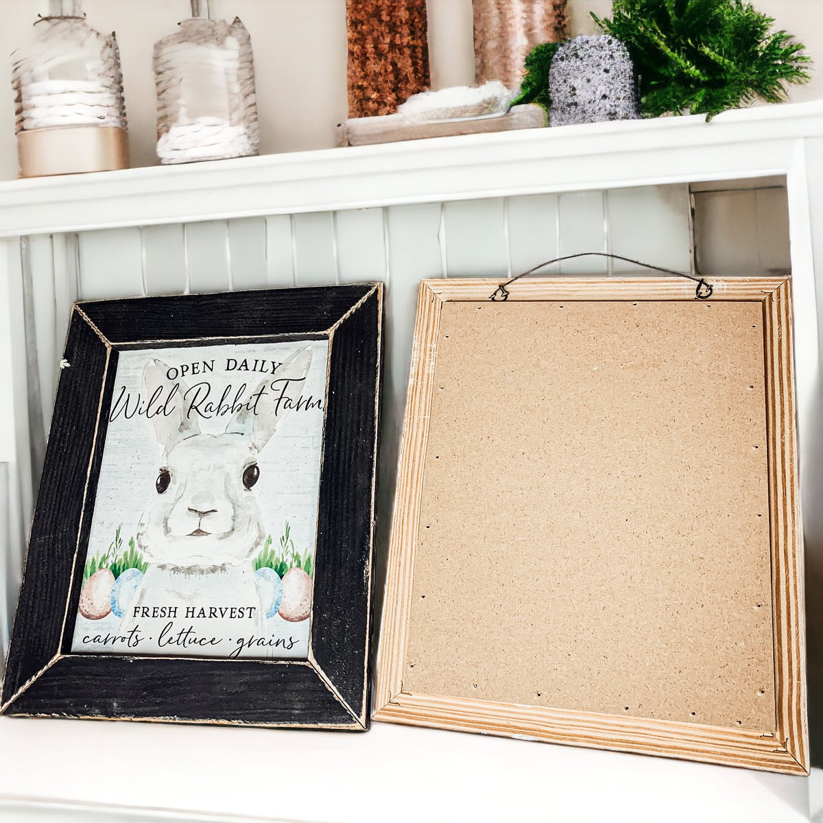 Wild Rabbit Farms Easter sign featuring a rustic design with pastel eggs and a hand-painted wooden frame.