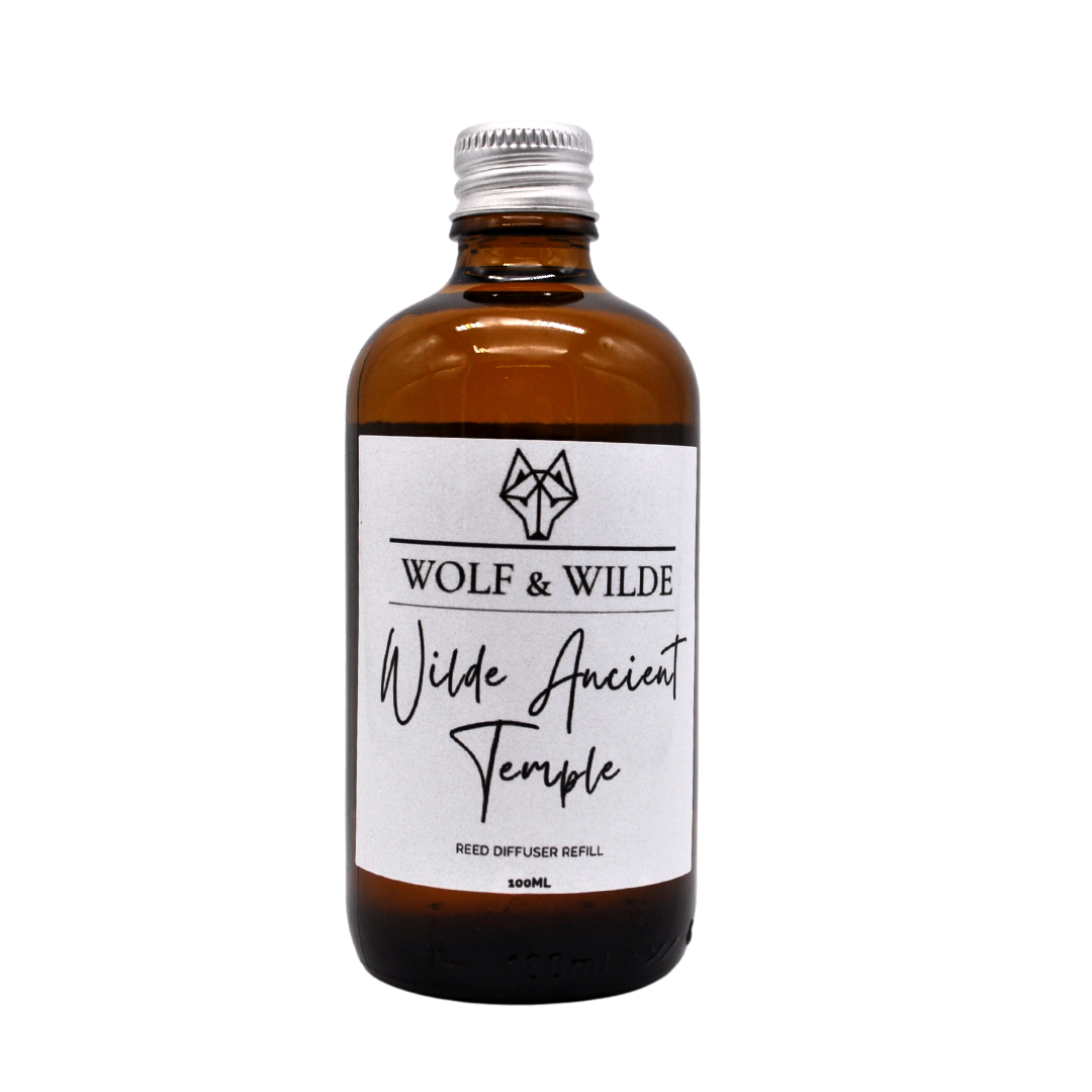 Wilde Ancient Temple 100ML Luxury Reed Diffuser Refill in elegant amber glass bottle with aluminum cap, showcasing its rich woody fragrance.