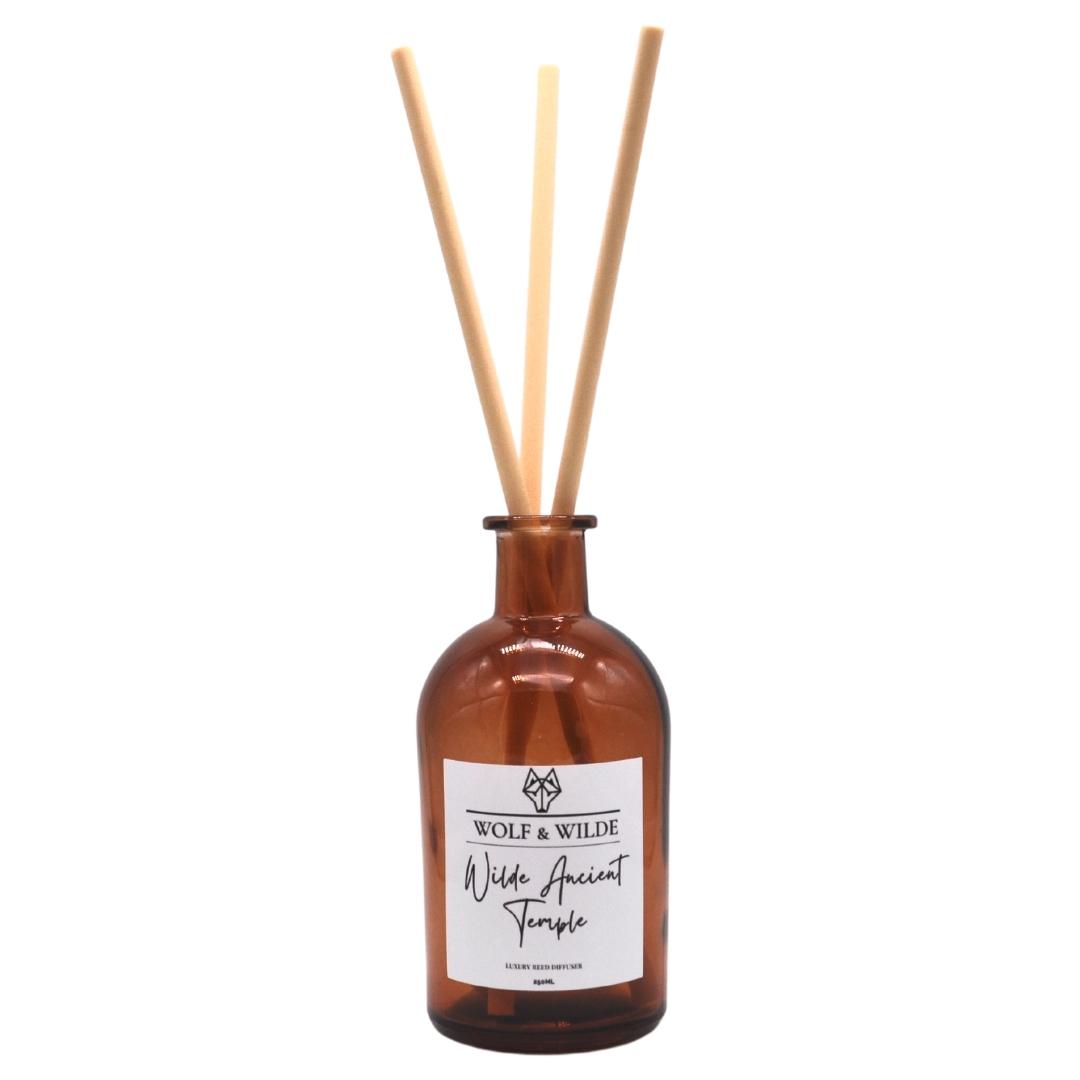 Wilde Ancient Temple Apothecary Reed Diffuser in amber bottle with natural reeds, showcasing its elegant design and eco-friendly materials.