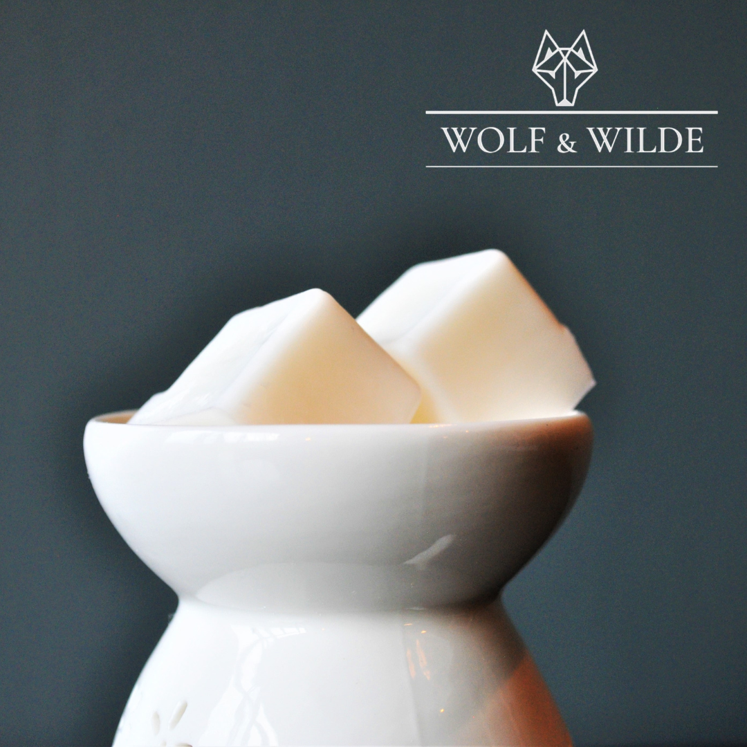 Wilde Ancient Temple Soy Wax Melts in a decorative packaging, showcasing the rich woody sandalwood fragrance with warm spices.