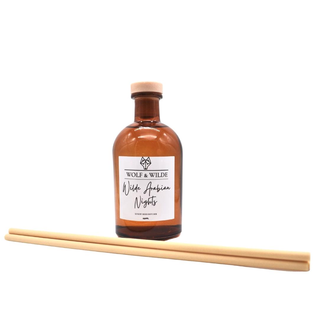 Wilde Arabian Nights Apothecary Reed Diffuser in an amber bottle with natural reeds, showcasing its luxurious design and eco-friendly materials.