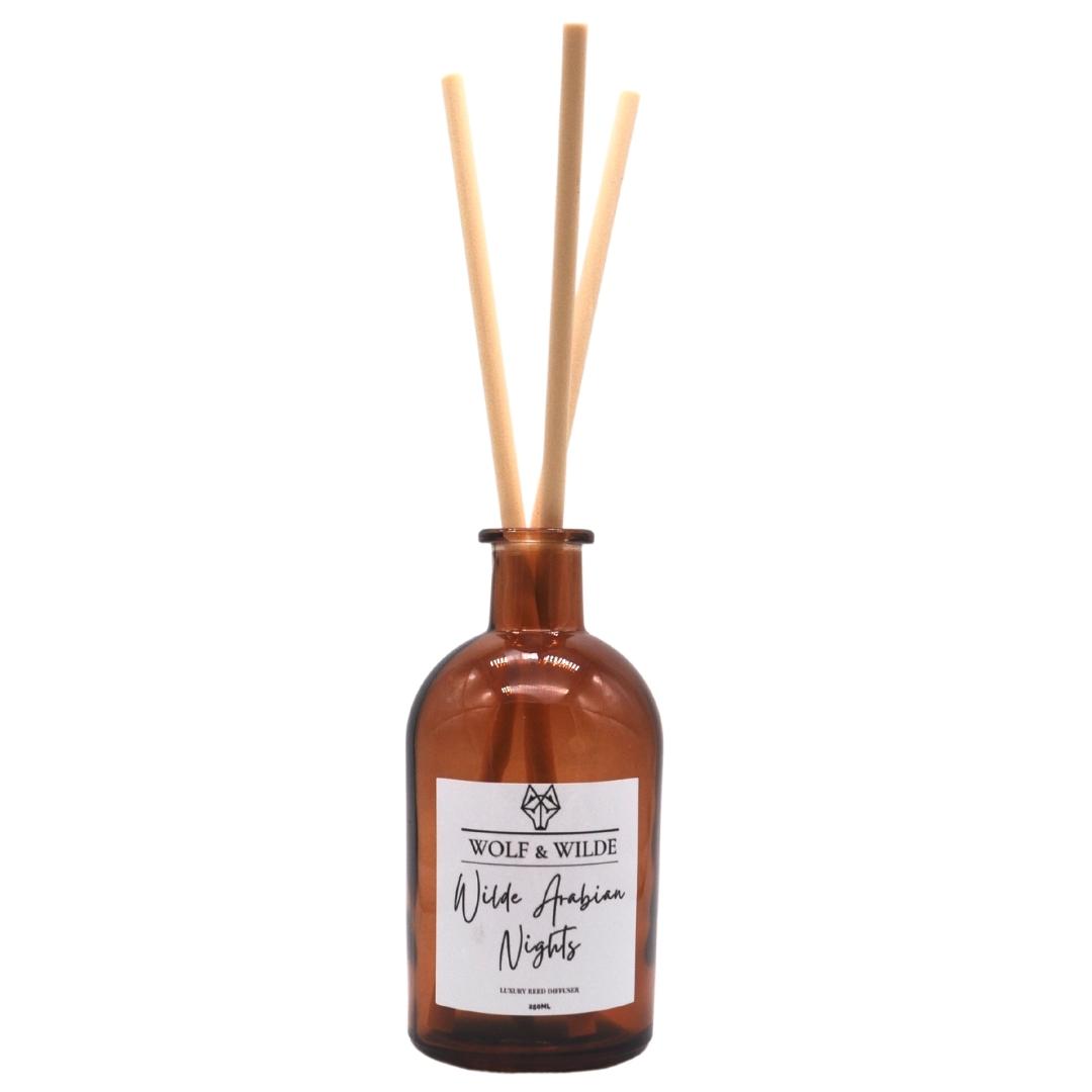 Wilde Arabian Nights Apothecary Reed Diffuser in an amber bottle with natural reeds, showcasing its luxurious design and eco-friendly materials.