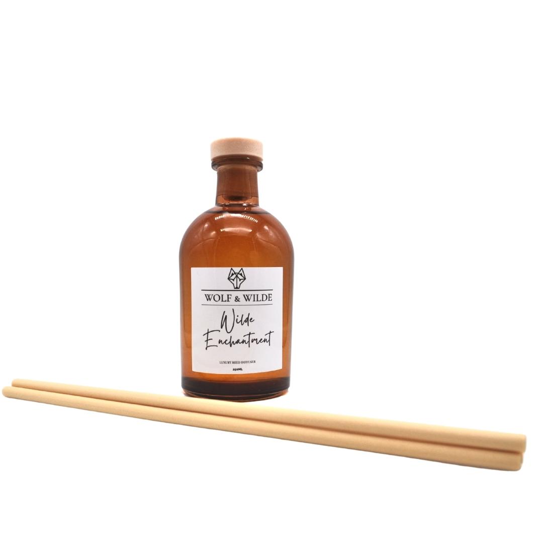 Wilde Enchantment Apothecary Reed Diffuser 250ML in amber bottle with natural reeds, showcasing elegant design and eco-friendly materials.