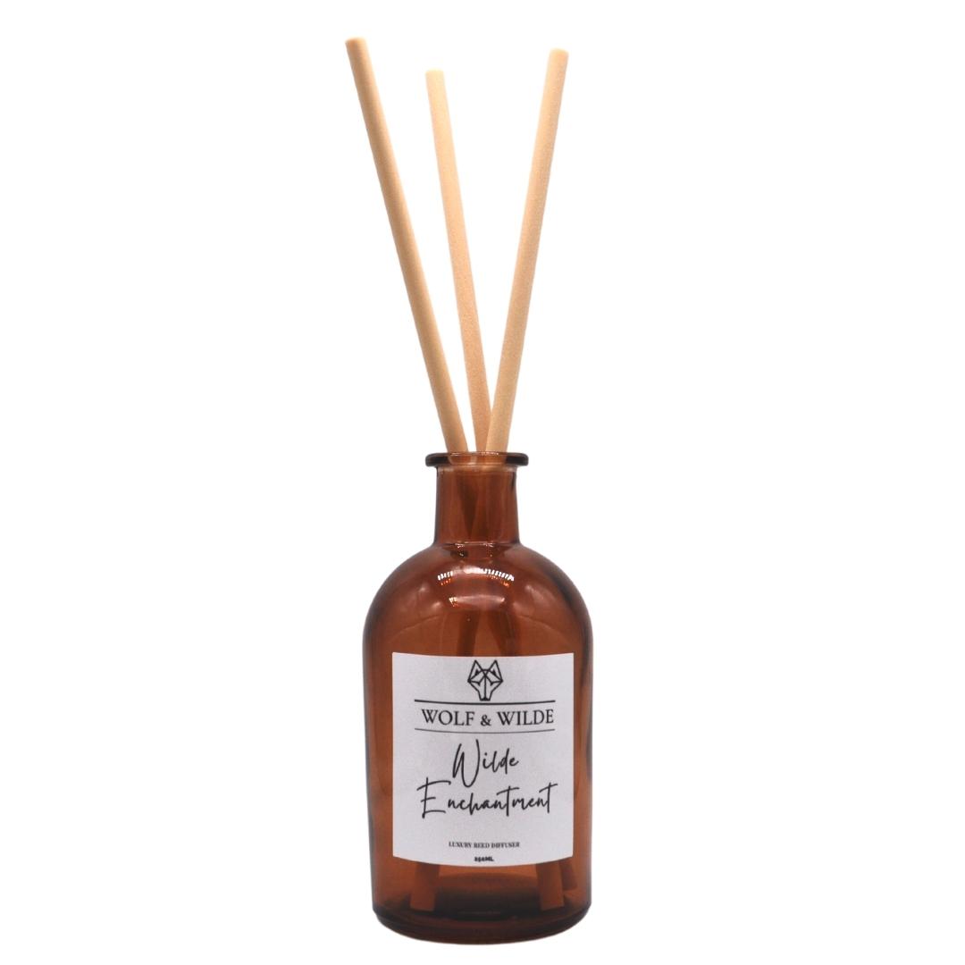 Wilde Enchantment Apothecary Reed Diffuser 250ML in amber bottle with natural reeds, showcasing elegant design and eco-friendly materials.