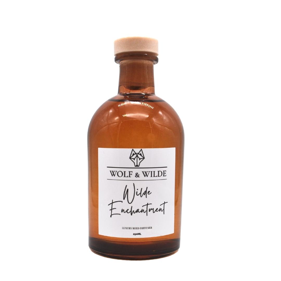 Wilde Enchantment Apothecary Reed Diffuser 250ML in amber bottle with natural reeds, showcasing elegant design and eco-friendly materials.