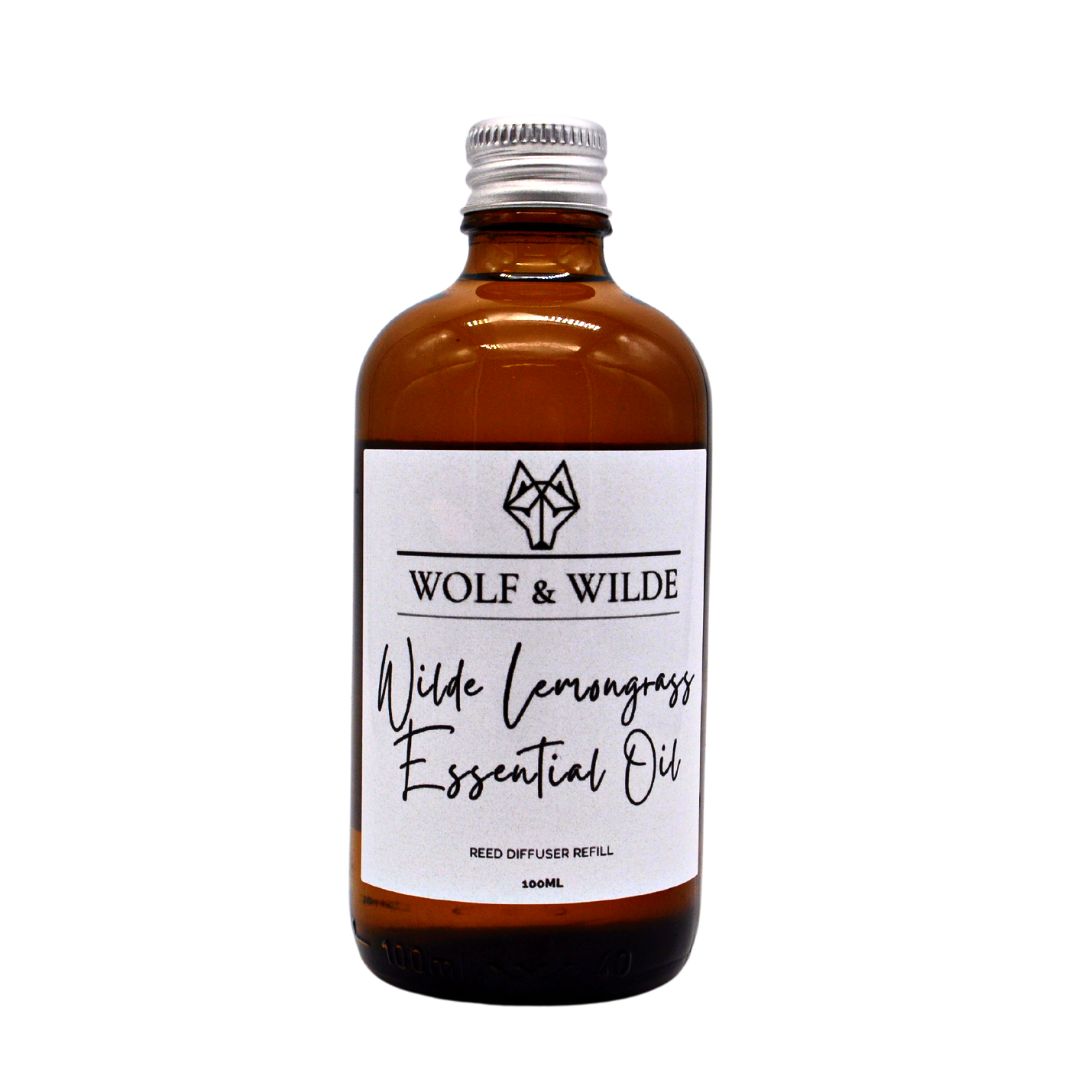 Wilde Lemongrass Essential Oil Reed Diffuser Refill in an elegant amber glass bottle with grey reeds, showcasing its luxurious design.