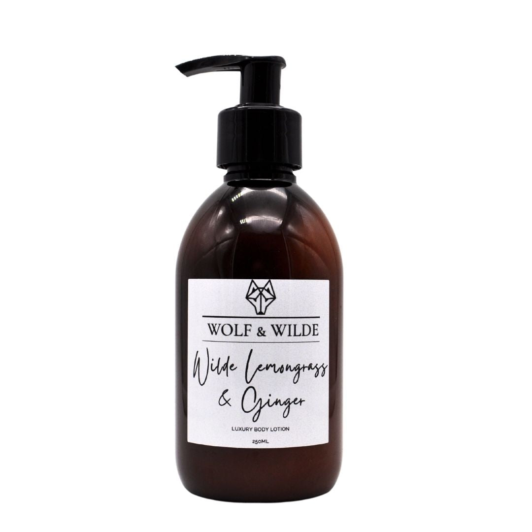 Wilde Lemongrass & Ginger Luxury Body Lotion in a recyclable amber bottle, showcasing its vibrant packaging and luxurious texture.