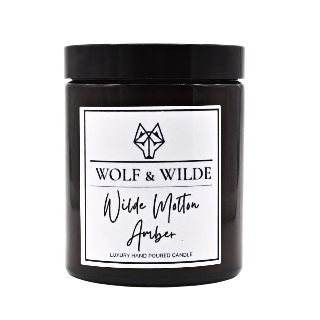 Wilde Molten Amber Luxury Aromatherapy Scented Candle with rich amber and floral notes, elegantly packaged for a luxurious experience.