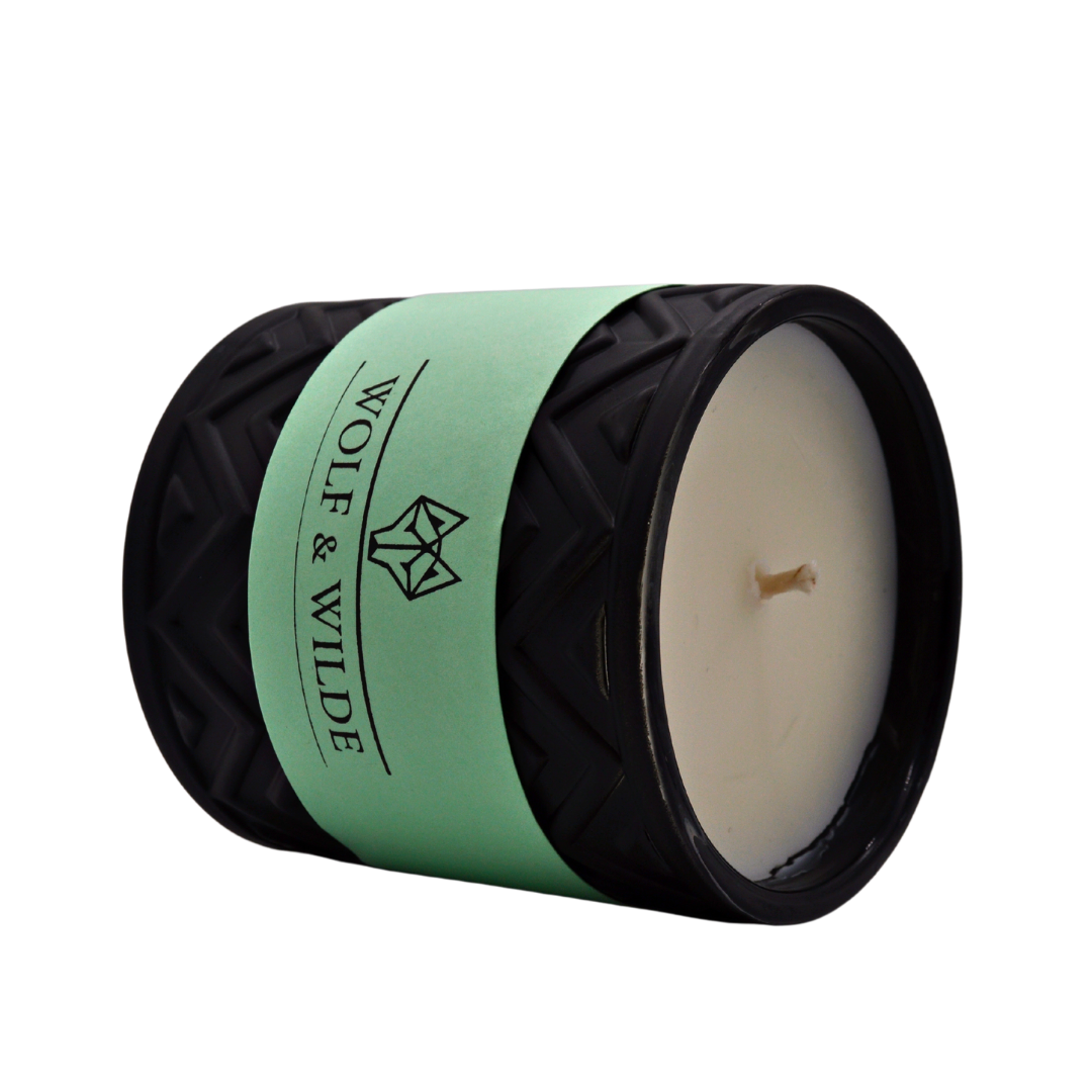 Wilde Seychelles Luxury Aromatherapy Scented Candle with exotic fragrance notes of bergamot, coconut, and vanilla in an elegant jar.