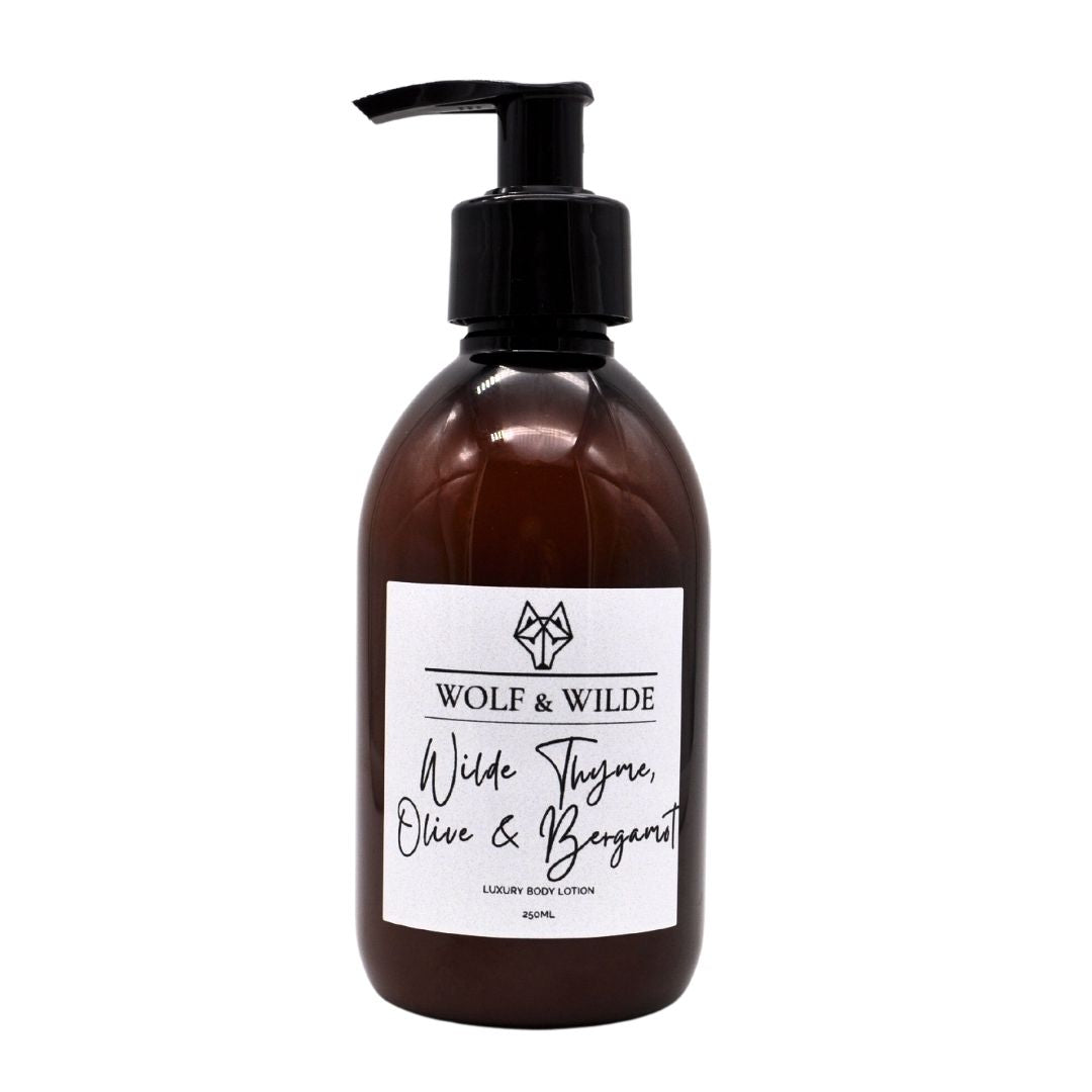 Wilde Thyme, Olive & Bergamot Luxury Body Lotion in a recyclable amber bottle, showcasing its elegant design and luxurious texture.