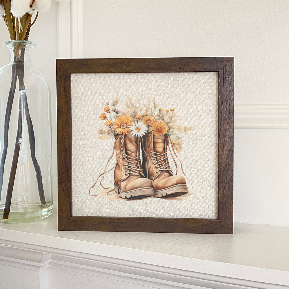 Wildflower Boots Framed Sign with a wood frame, featuring eco-friendly printing on a linen-look background.