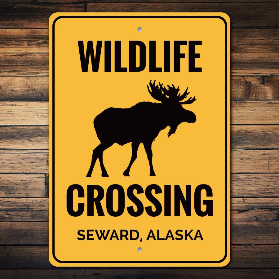 Wildlife Crossing Sign made of durable aluminum, featuring customizable text and pre-drilled holes for easy mounting, perfect for outdoor decor.