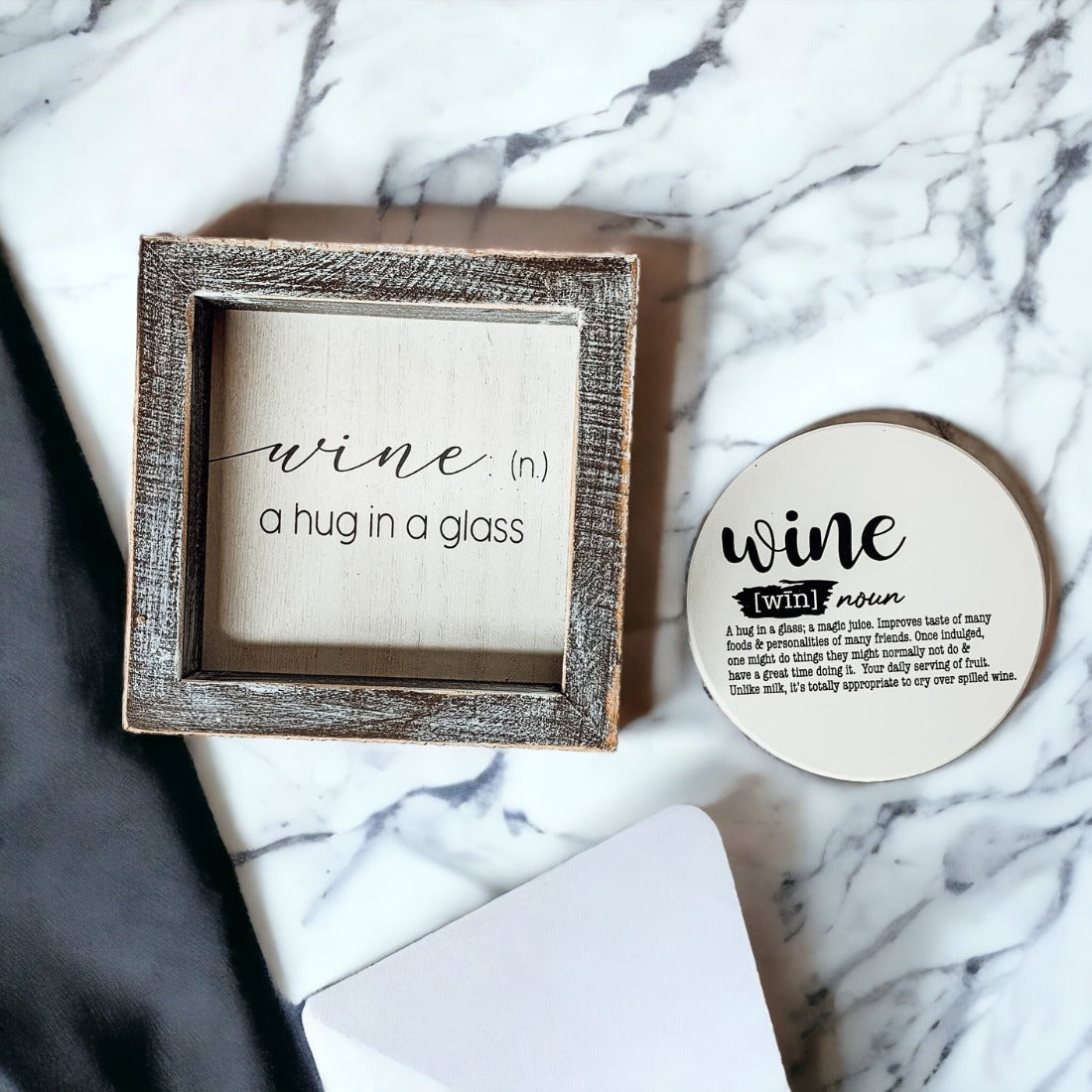 A beautifully framed wooden sign that reads 'Wine: A Hug', featuring a white-washed finish, perfect for home decor.