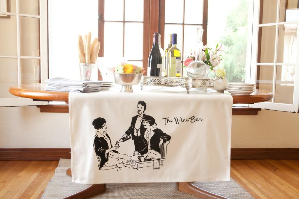 Stylish white Wine Bar table banner made of polyester and cotton, elegantly displayed on a table.