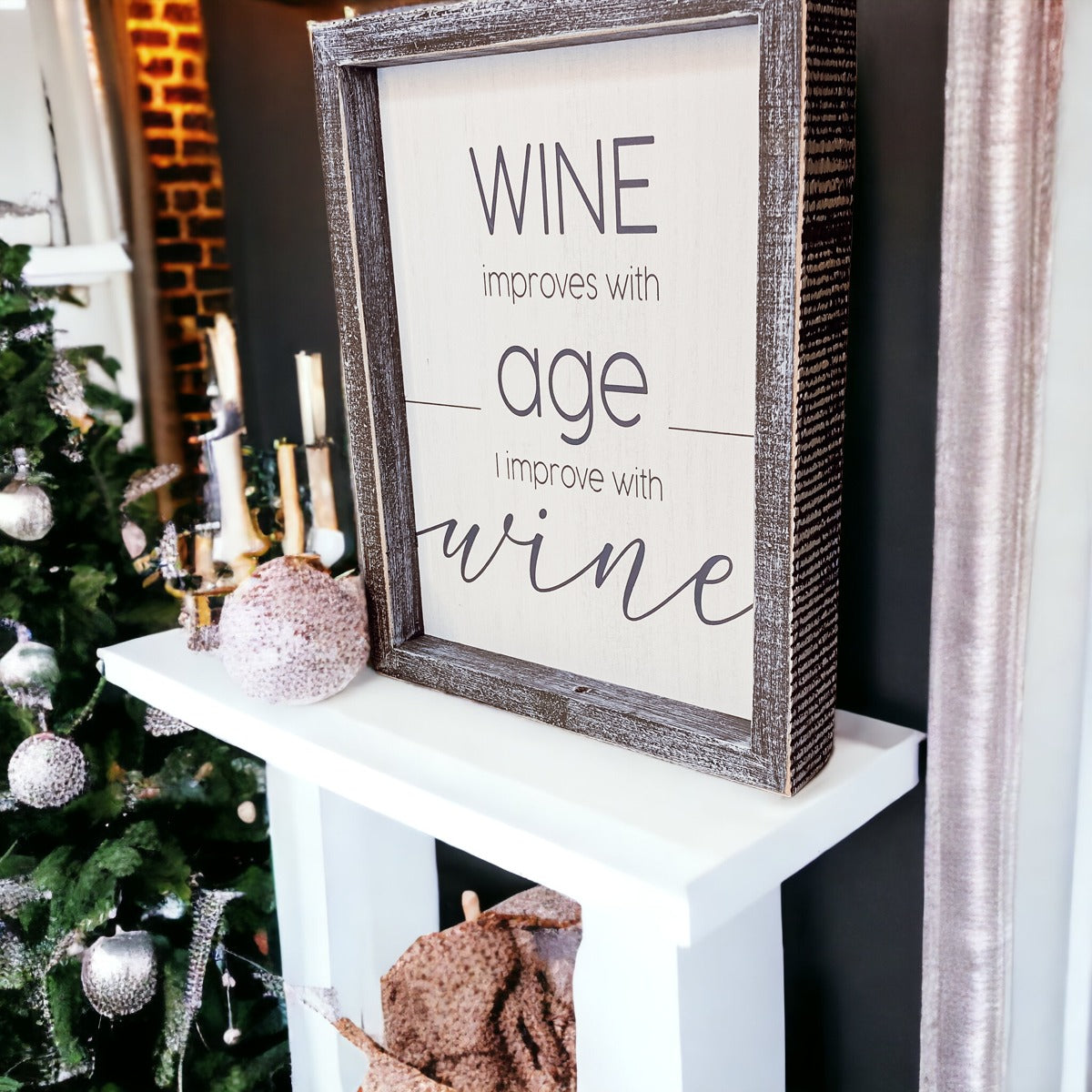 A stylish wood sign that reads 'Wine improves with age, I improve with wine', featuring a modern design in white and grey colors.