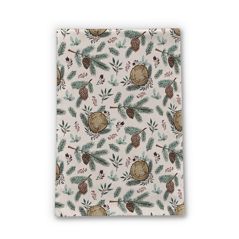 Winter-themed tea towel featuring branches, berries, and pine cones design, made from cotton twill, perfect for kitchen use.