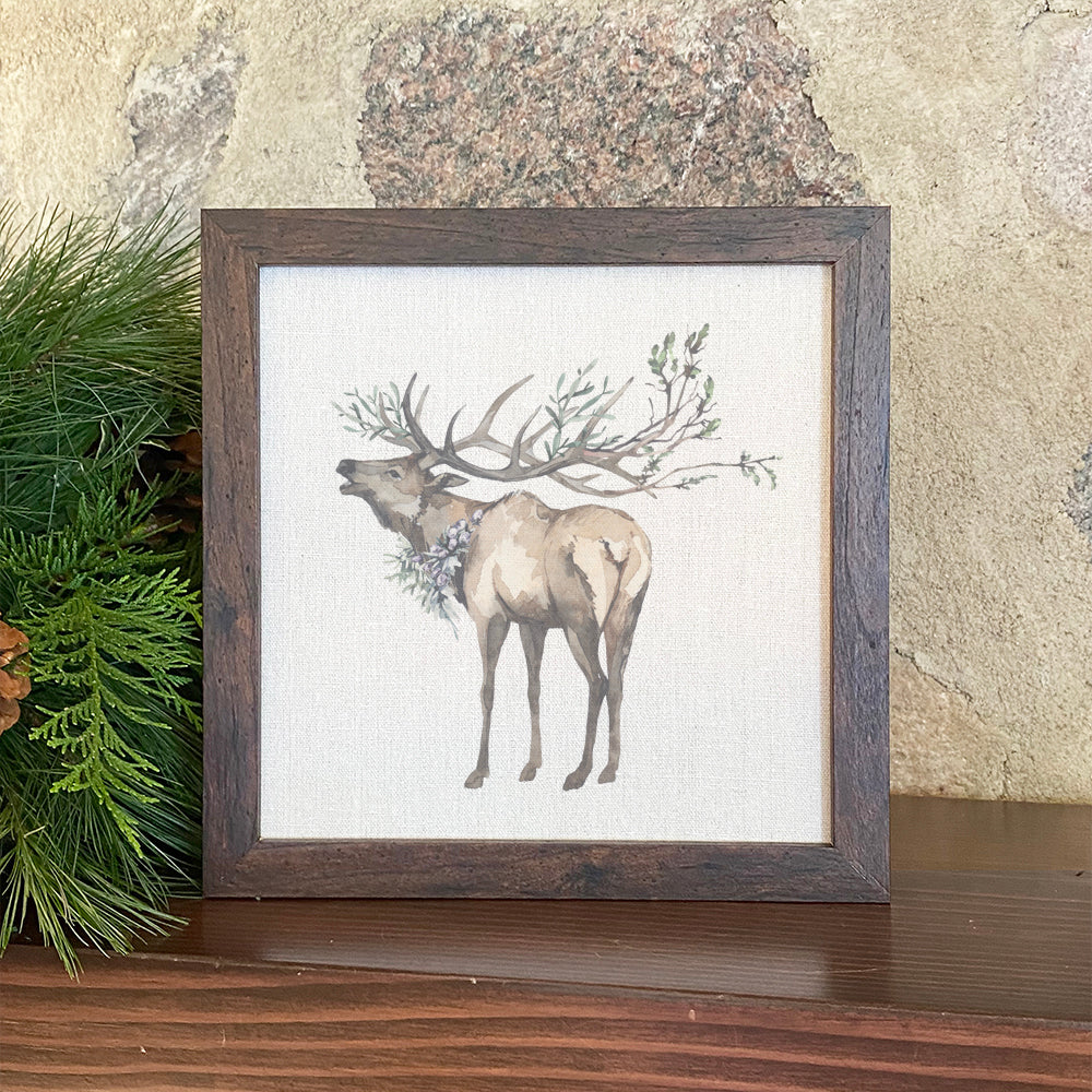 Winter Elk framed sign with a stylized wood frame, featuring eco-friendly ink printing on a linen-look background.