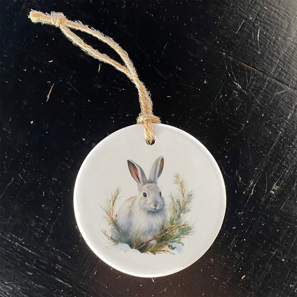 A beautifully crafted porcelain ornament featuring a winter rabbit design, perfect for holiday decor or gifting.