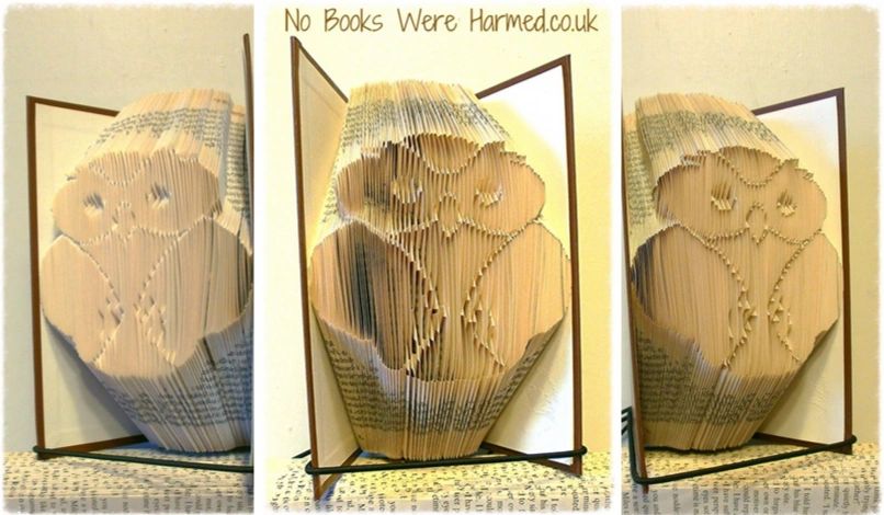 Handcrafted Wise Wee Owl made from vintage book pages, showcasing intricate folds and unique design.