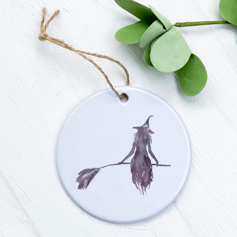 A high-quality porcelain ornament featuring a Witch Silhouette design, showcasing intricate details and a glossy finish.