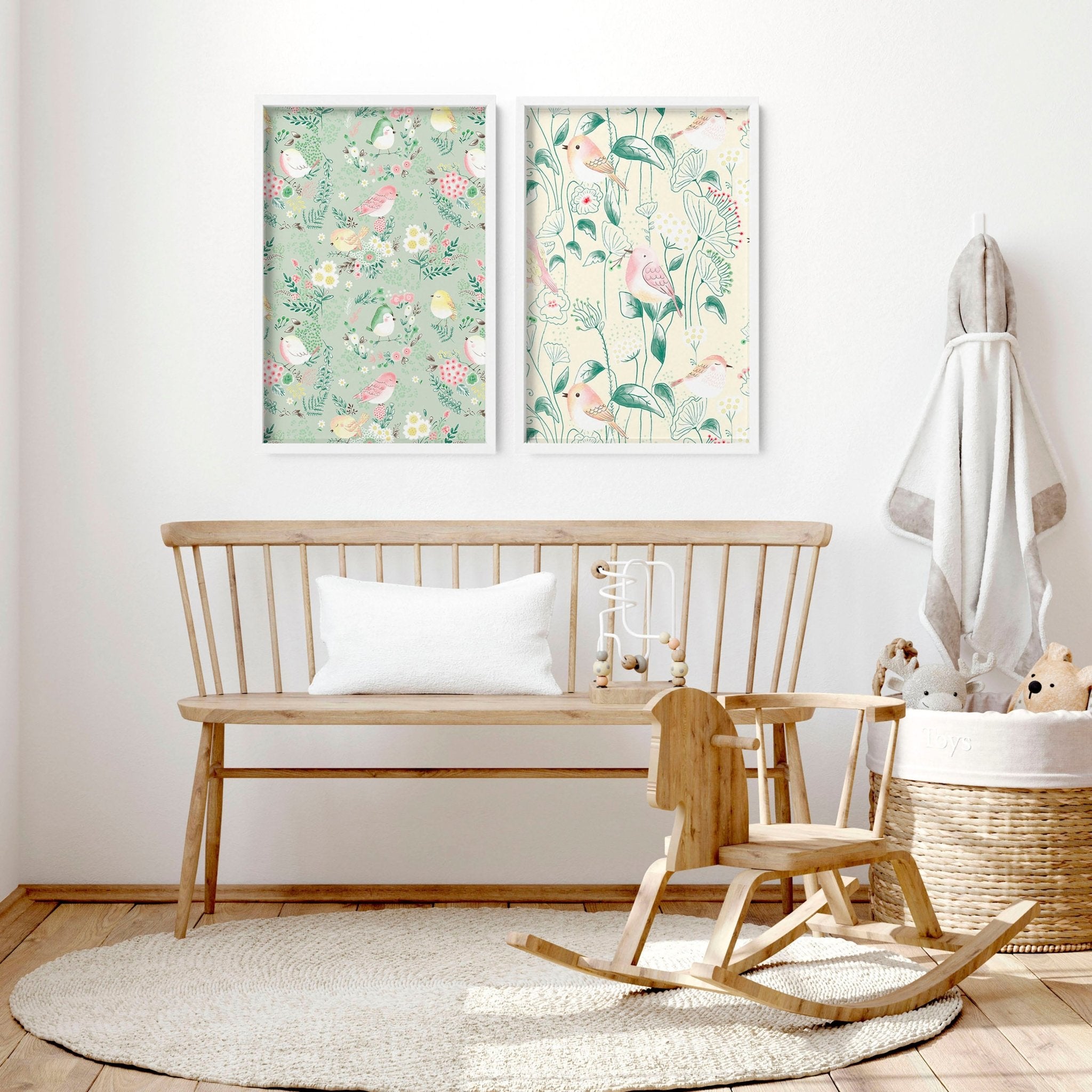 Set of 2 woodland nursery wall art prints featuring whimsical birds and flowers in soft pink, ivory, and sage green tones.