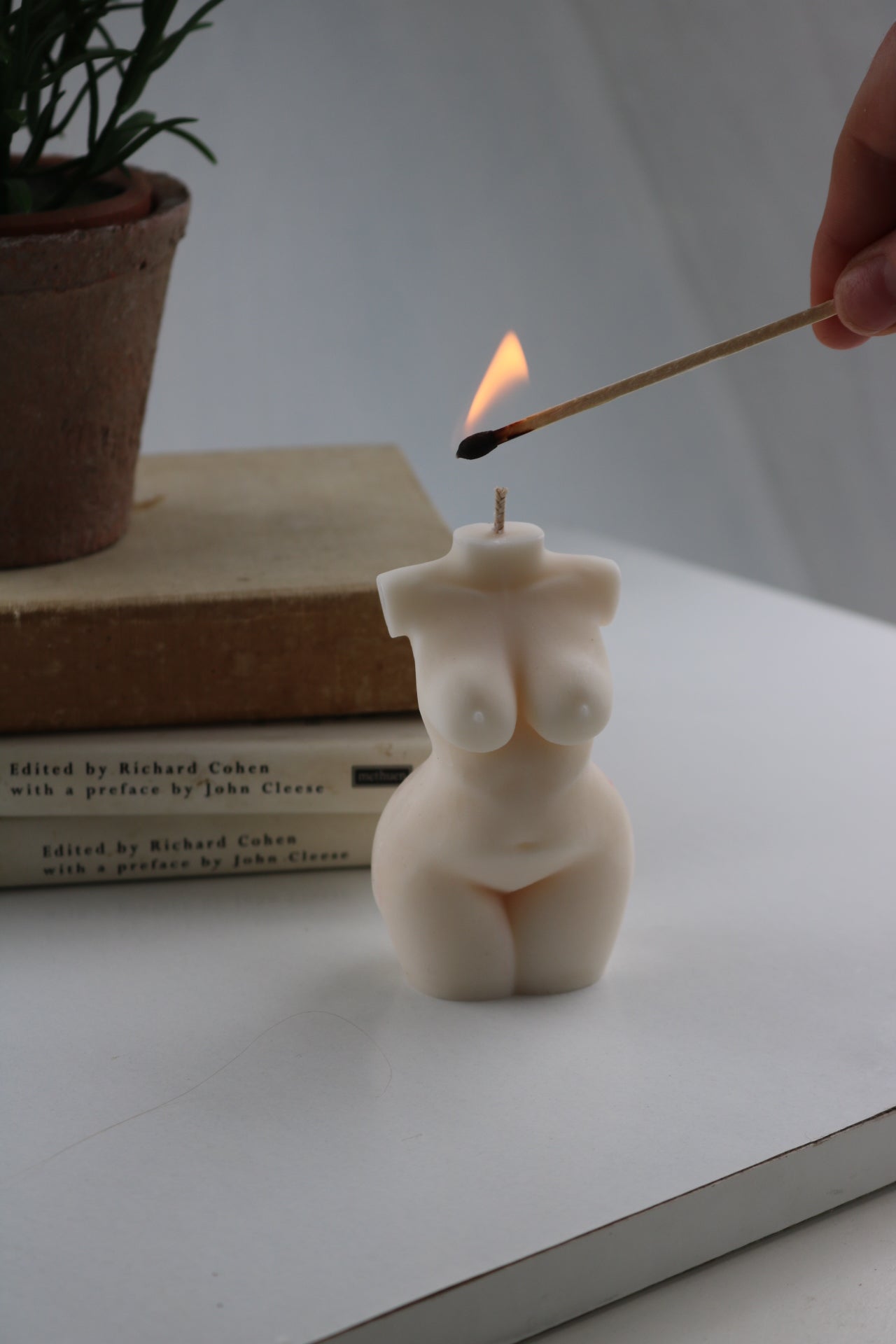 A beautifully crafted Woman Torso Candle made from a soy wax blend, showcasing its sculptural design and elegant form.