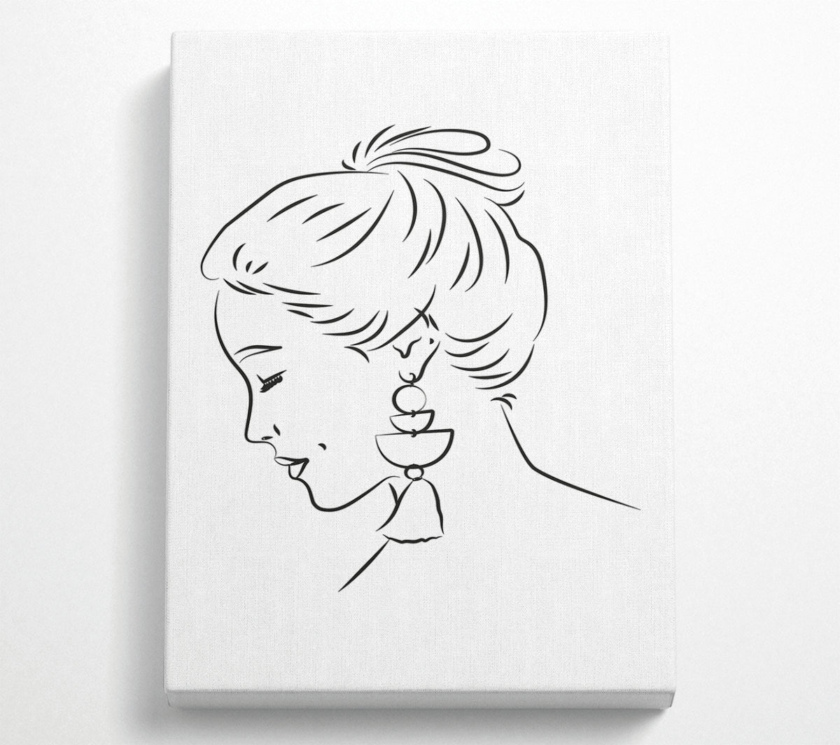 Elegant canvas art featuring a woman with earrings, mounted on a 44mm box frame, ready to hang.