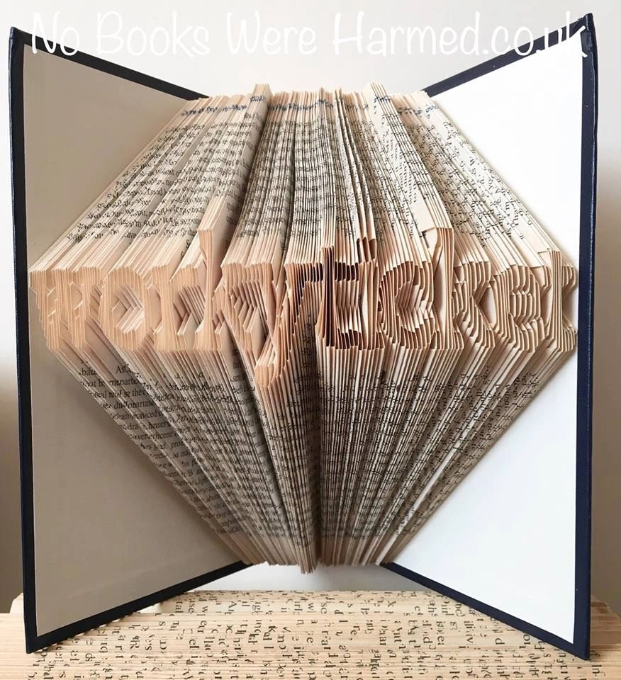 A unique piece of book art, hand-folded from vintage pages, showcasing intricate designs and textures.