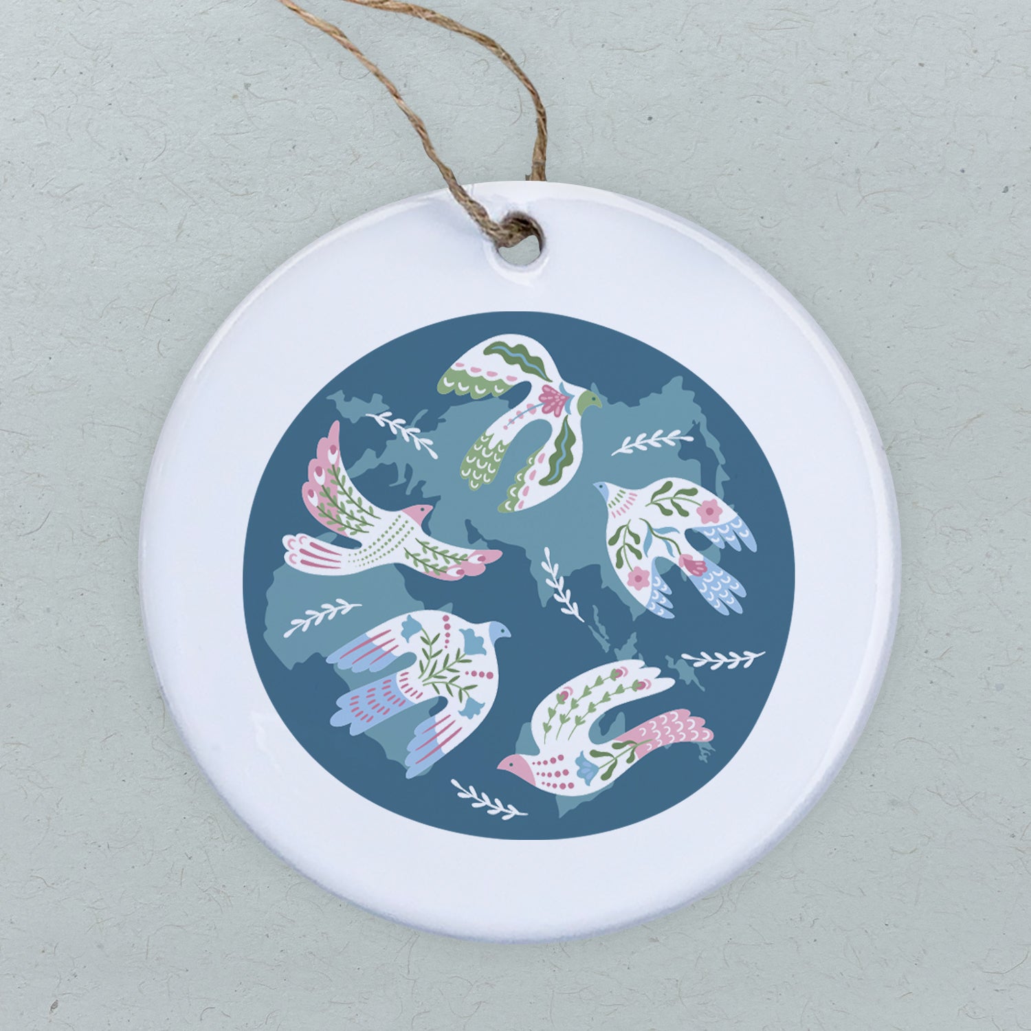 A beautifully crafted porcelain ornament featuring original dove designs, perfect for gifting or home decor.