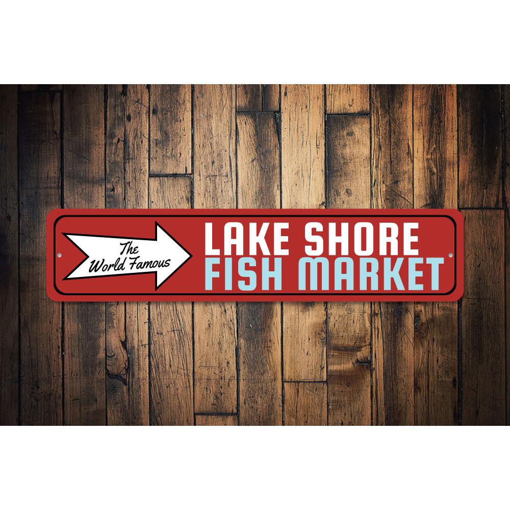 A decorative aluminum sign featuring the World Famous Fish Market design, showcasing vibrant colors and customizable text options, perfect for lakehouse decor.