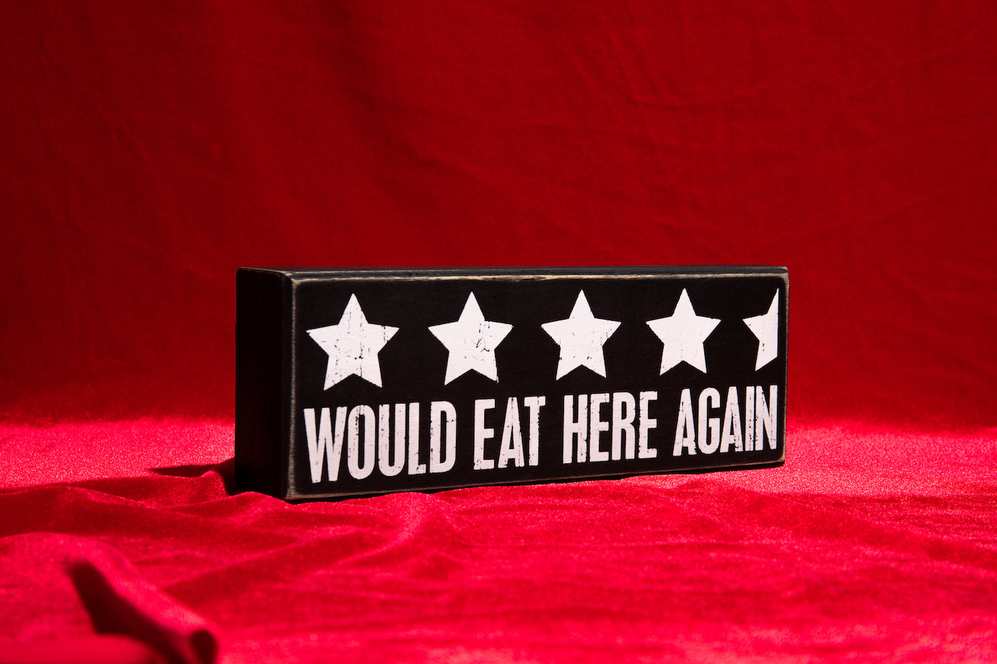 A stylish wooden box sign with a black and white design featuring the phrase 'Would Eat Here Again' and a 4.5-star rating.