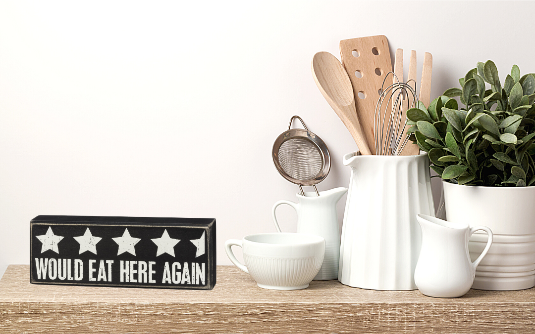 A stylish wooden box sign with a black and white design featuring the phrase 'Would Eat Here Again' and a 4.5-star rating.