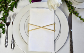 X Wrap Matte Gold napkin wraps featuring a unique design and elegant matte finish, perfect for enhancing table decor.