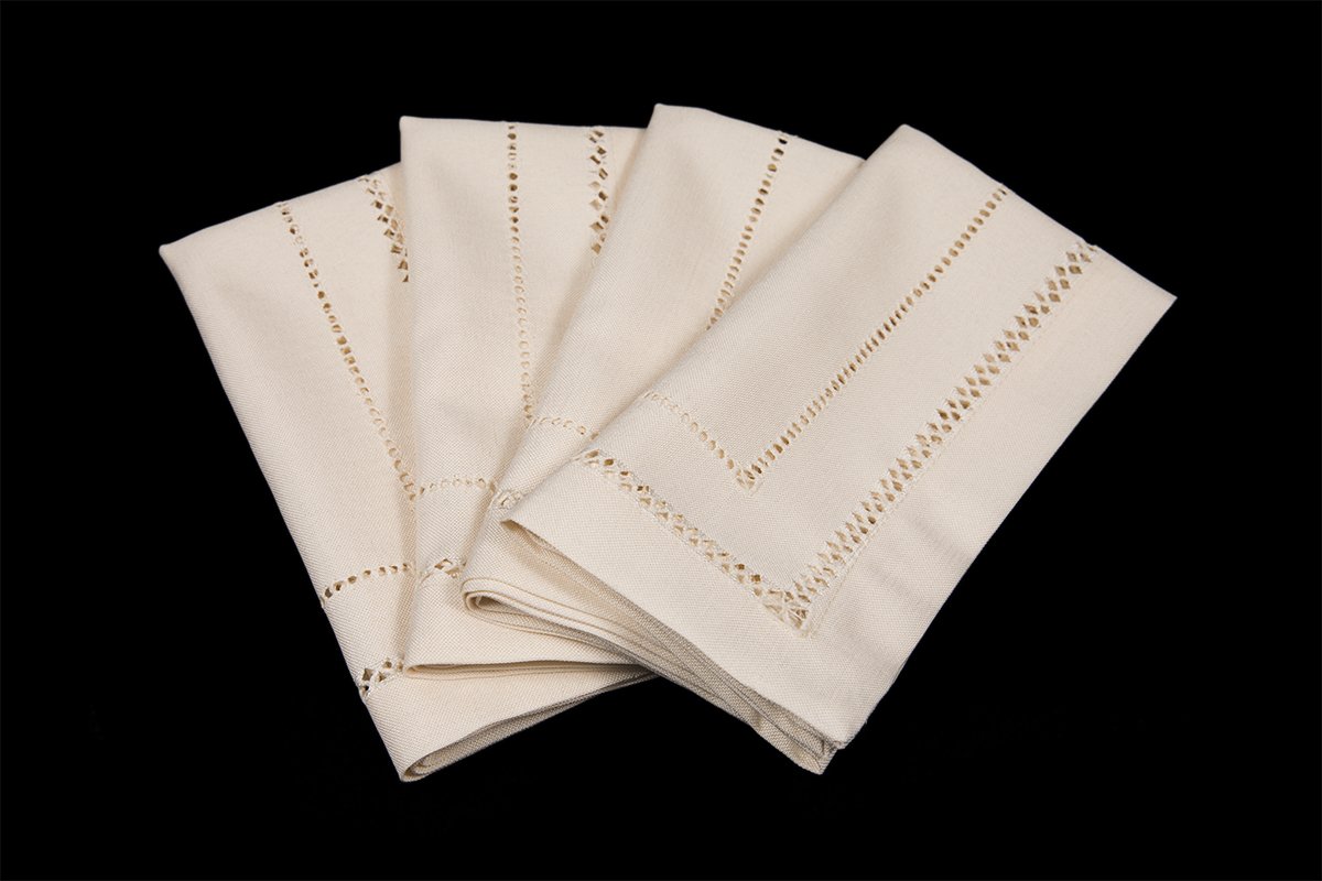 Set of 4 XD11099 Double Hemstitch Napkins in various colors, showcasing intricate hand-rendered cutwork trim.