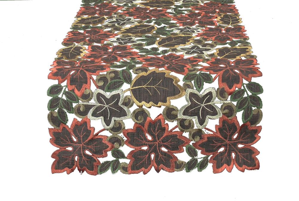 XD13019 Dainty Leaf Table Runner featuring autumn leaf embroidery on sheer mocha fabric, elegantly draped on a dining table.