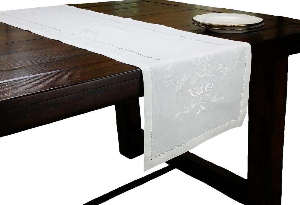 XD1495 Napa Sonoma hemstitch table runner featuring floral embroidery on a crisp linen background, showcasing intricate hemstitch detailing.