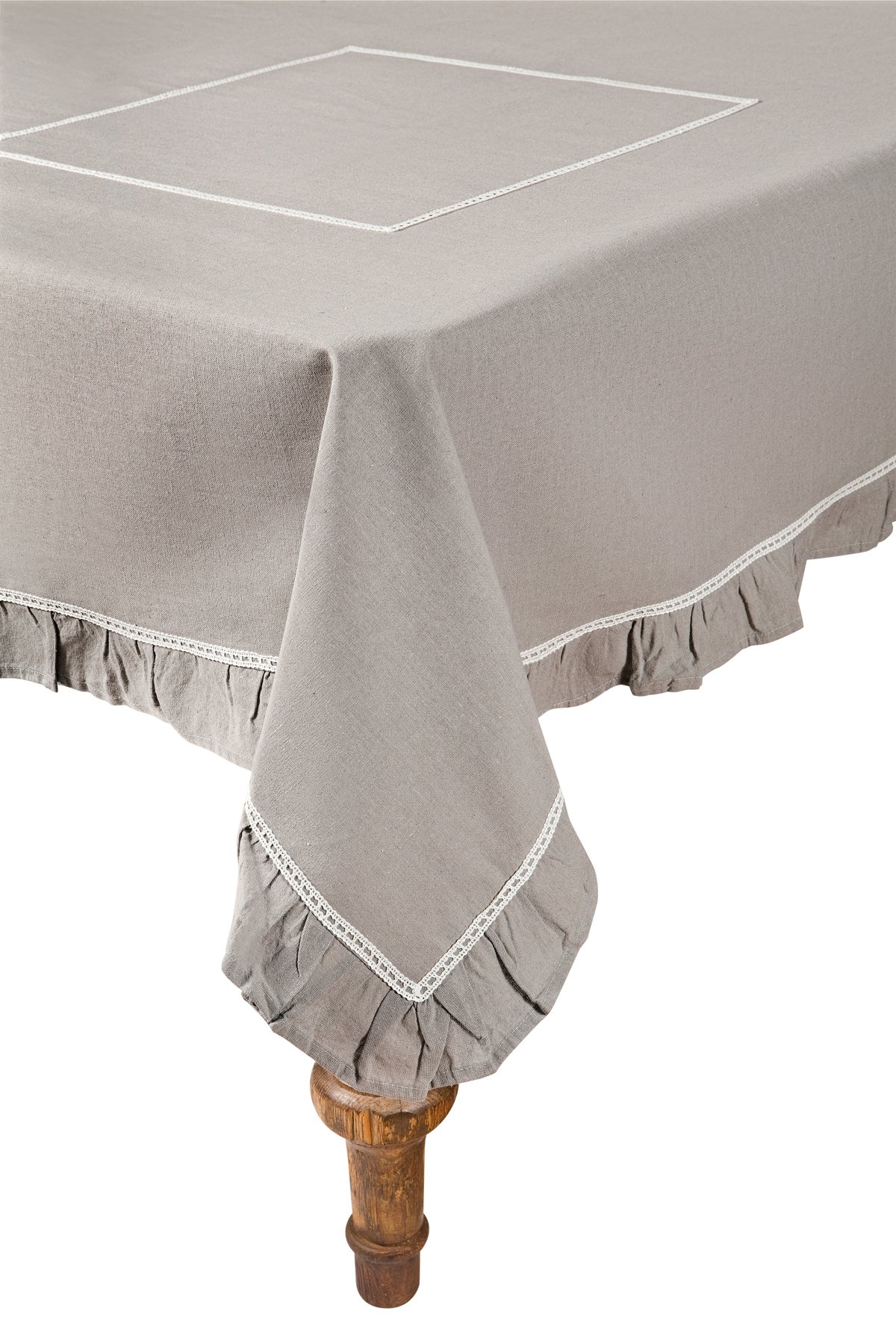 XD15110 Ruffle Trim Tablecloth with white lace accents and taupe fabric, elegantly draped over a dining table.