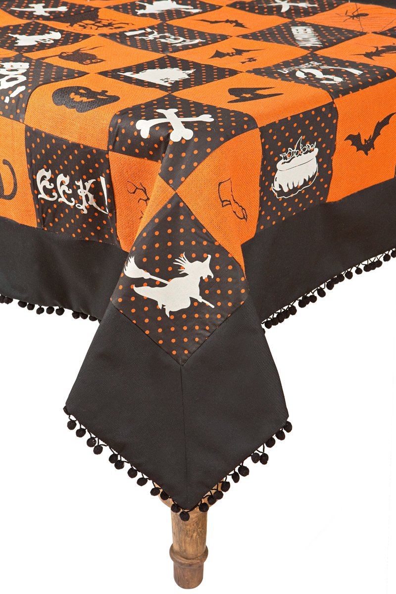 XD15834 Halloween Patchwork Tablecloth featuring black and orange patchwork with spooky silhouettes and pom-pom trim, perfect for Halloween decor.