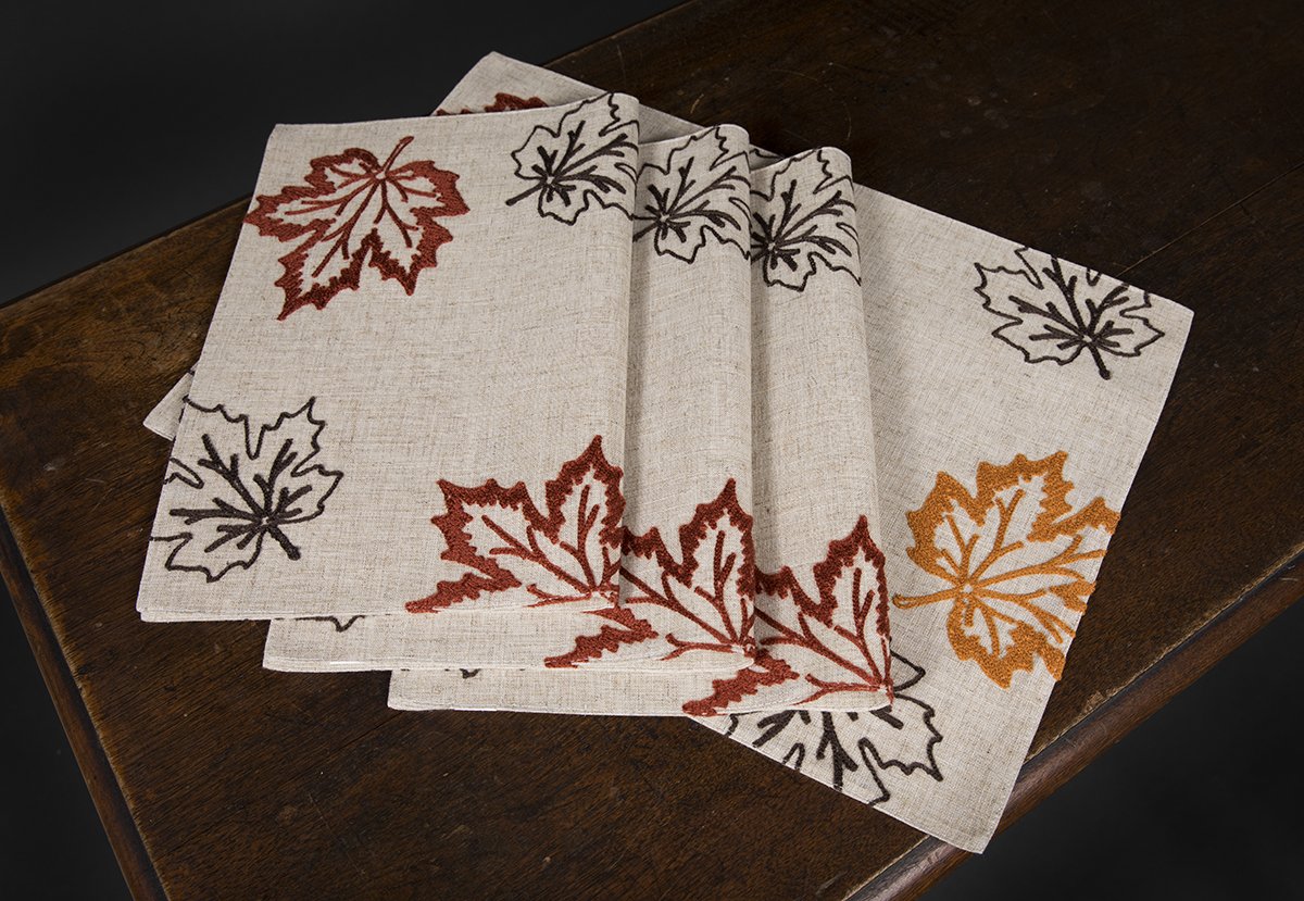 Set of 4 rustic autumn placemats featuring embroidered leaves in warm colors on a natural or coffee backdrop.